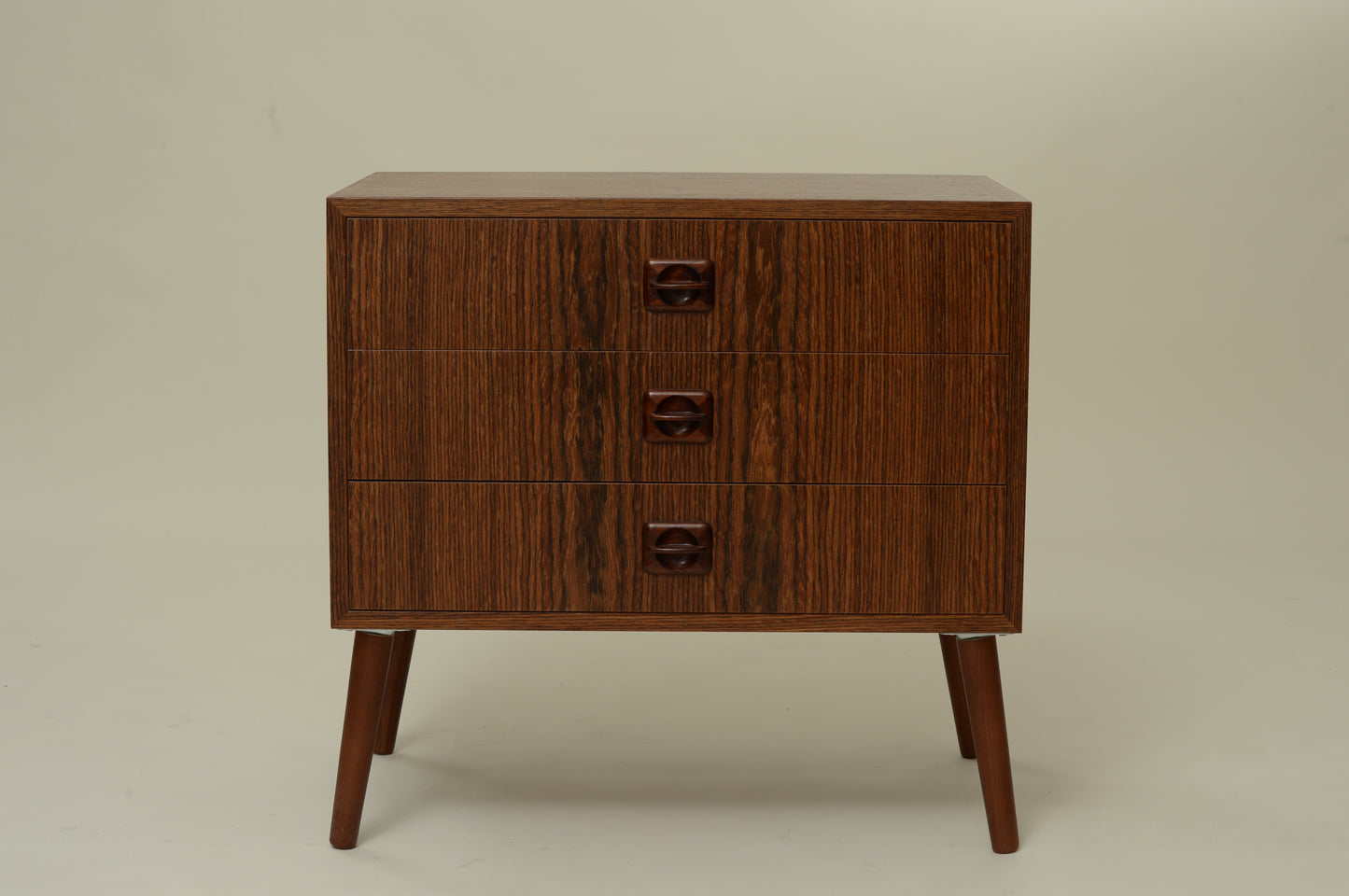 Petite commode plaquée palissandre pieds compas