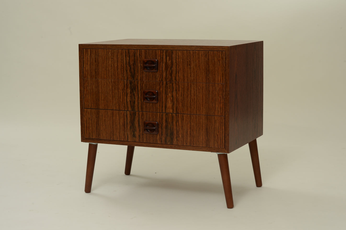 Petite commode plaquée palissandre pieds compas